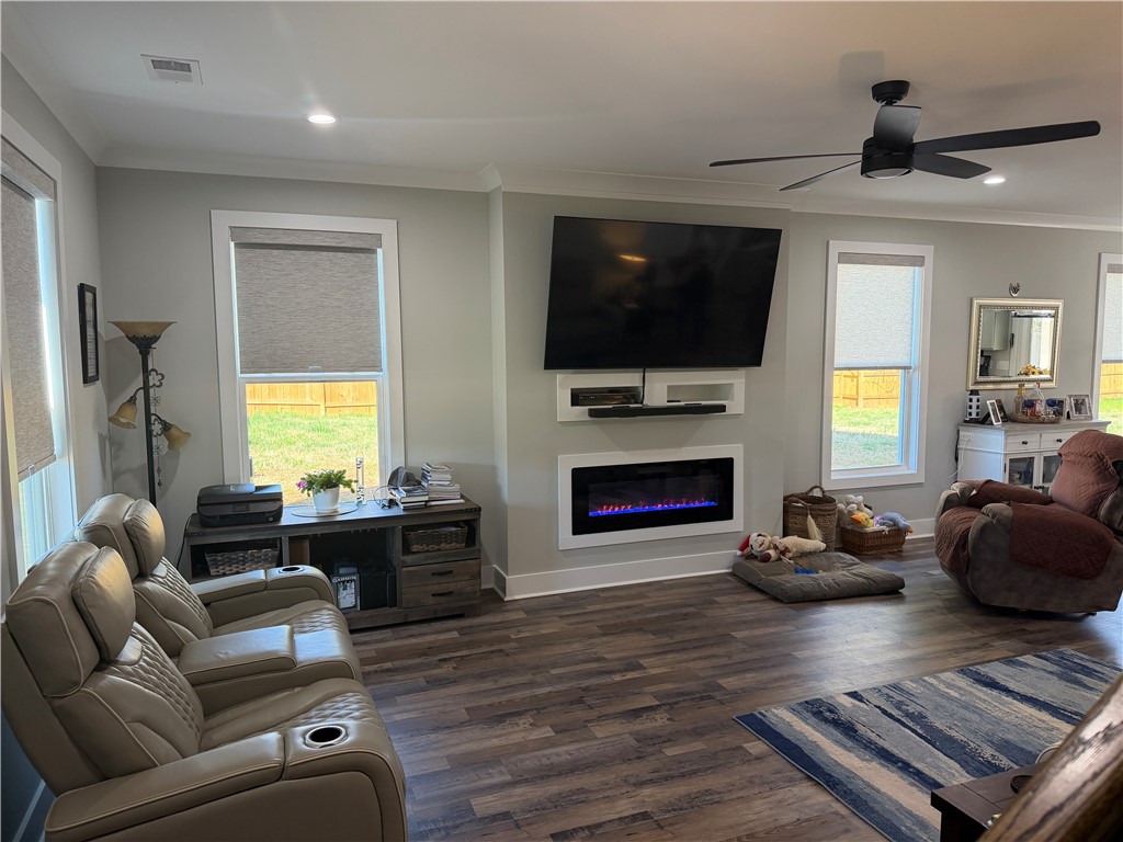 102 Turkey Trot Road Williamston, SC 29697 - Photo 3 of 37 This inviting living area boasts rich wood flooring and a modern fireplace feature.