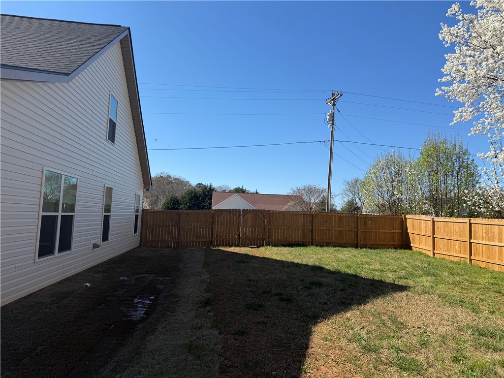 102 Turkey Trot Road Williamston, SC 29697 - Photo 32 of 37 This private yard features a durable wooden fence, perfect for outdoor enjoyment.