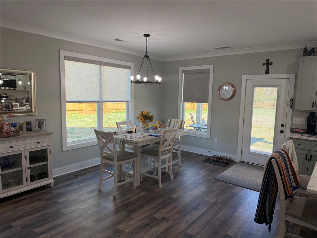 102 Turkey Trot Road Williamston, SC 29697 - Photo 6 of 37 This inviting dining area features ample natural light and durable flooring, perfect for everyday meals.