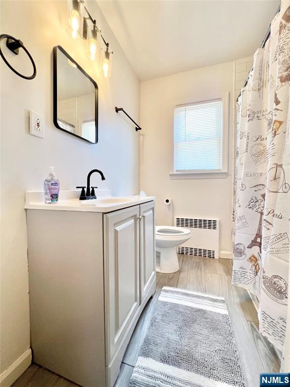 18 Pershing Street Garfield, NJ 07026 - Photo 13 of 16 a bathroom with a sink and a mirror
