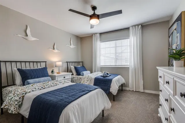 a spacious bedroom with a bed and a window