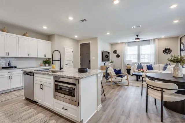 a bathroom with a sink a mirror and shower