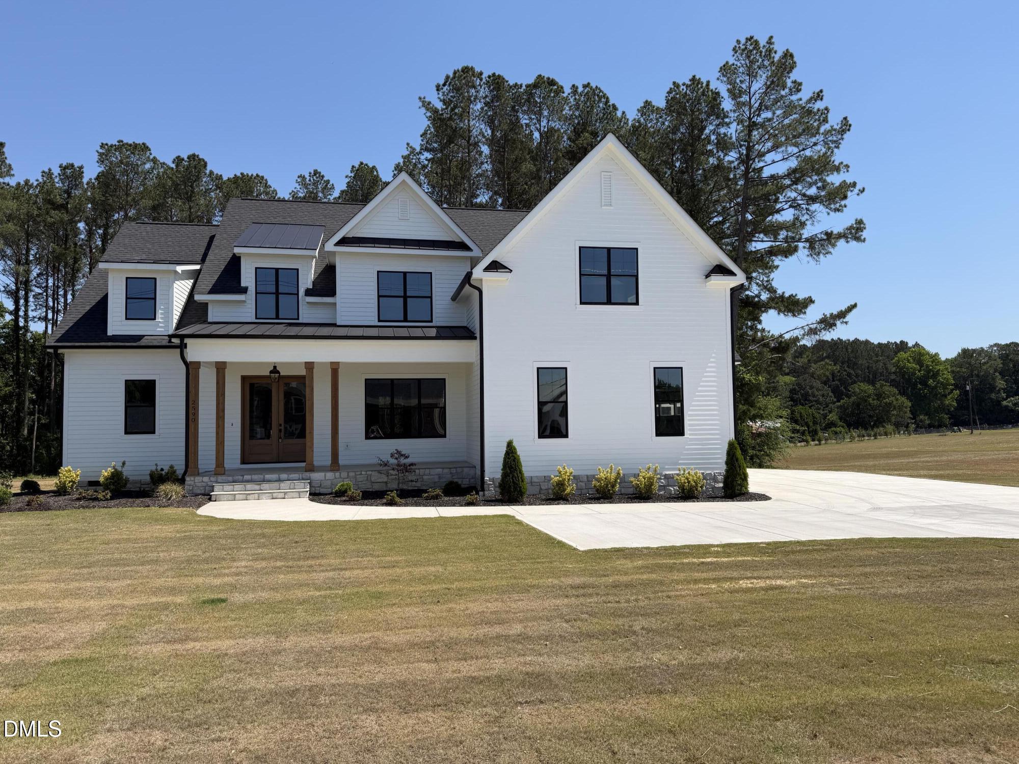 2590 Lassiter Road Four Oaks, NC 27524 - Photo 54 of 72 a front view of a house with a yard