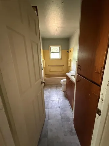 a bathroom with a sink and mirror