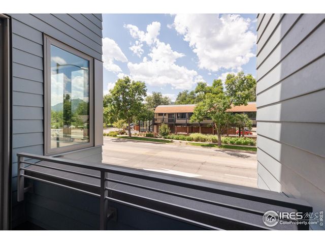 a view of a door and a street view