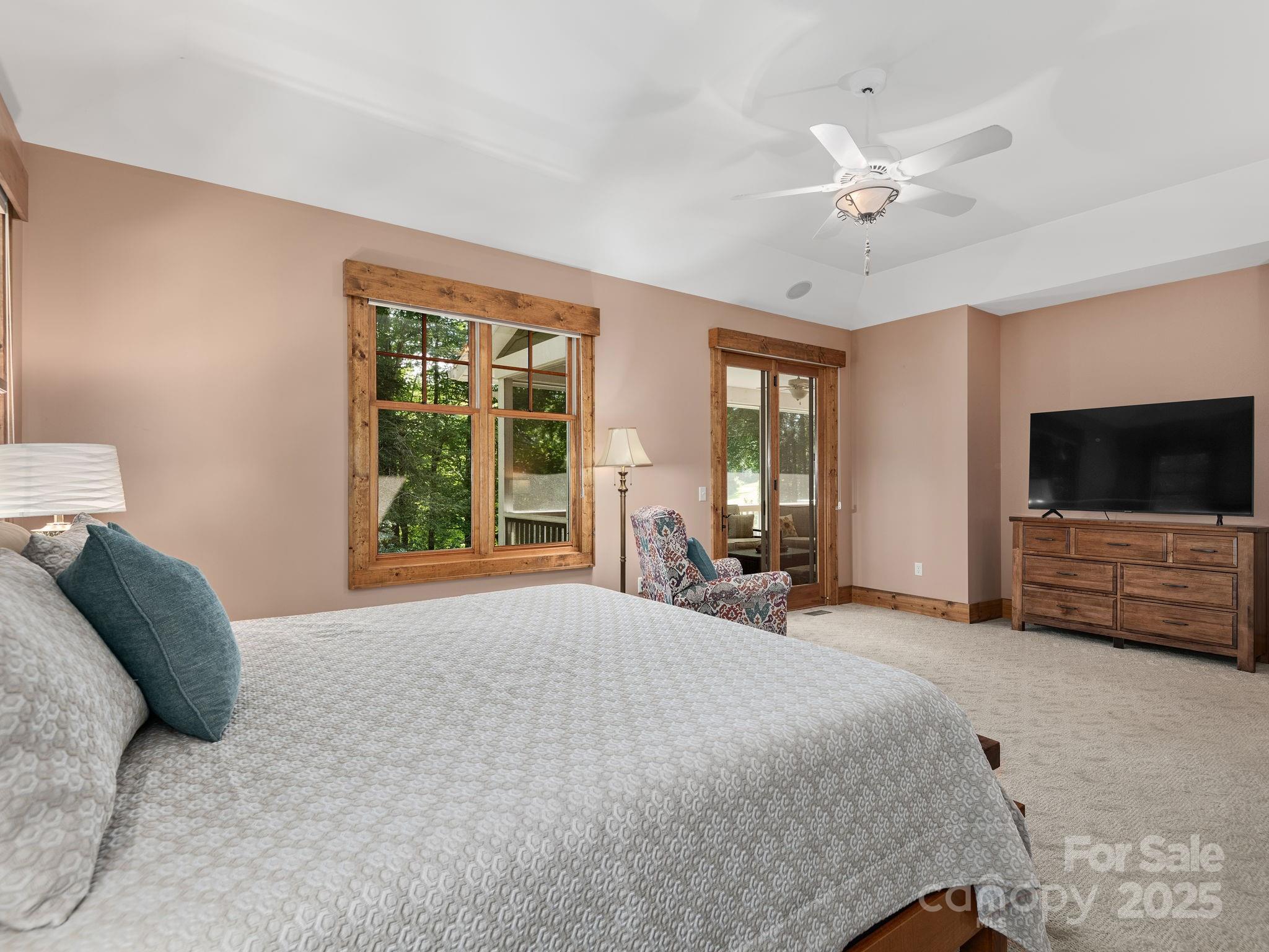 120 Mossy Rock Road Sapphire, NC 28774 - Photo 19 of 47 a bed room with furniture and a flat screen tv