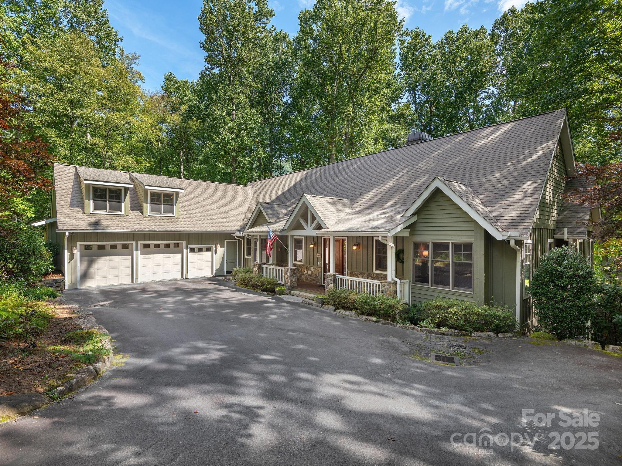 120 Mossy Rock Road Sapphire, NC 28774 - Photo 2 of 47 a view of a house with a yard