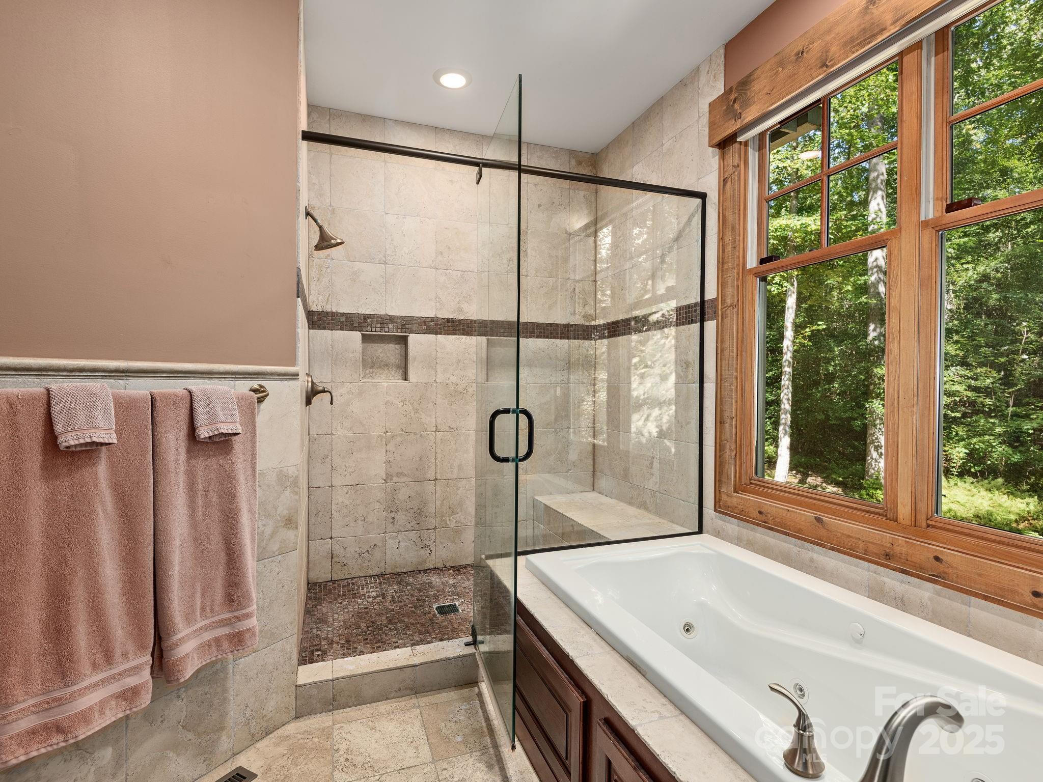 120 Mossy Rock Road Sapphire, NC 28774 - Photo 22 of 47 a bathroom with a tub and a shower