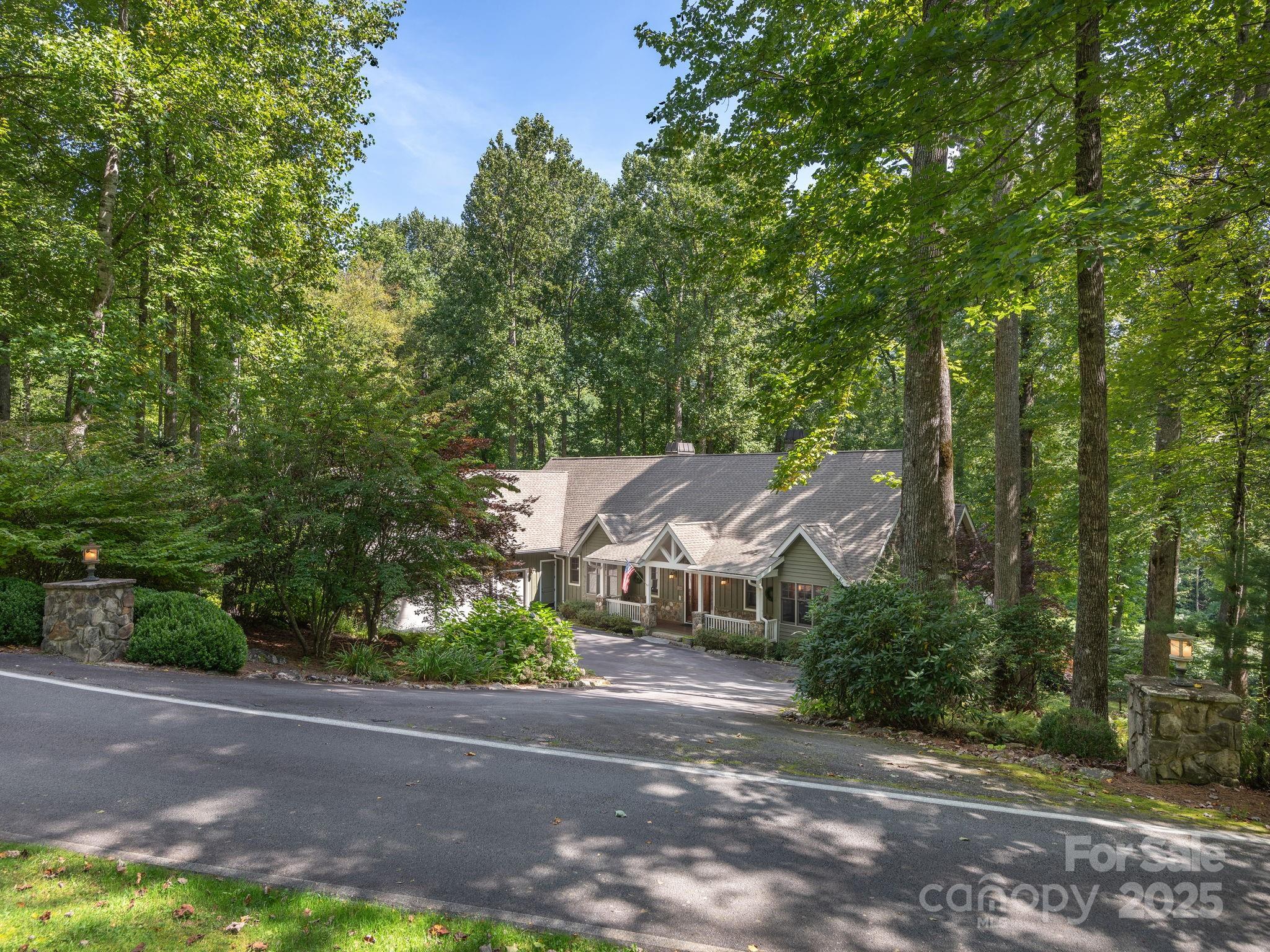 120 Mossy Rock Road Sapphire, NC 28774 - Photo 3 of 47 an aerial view of a house