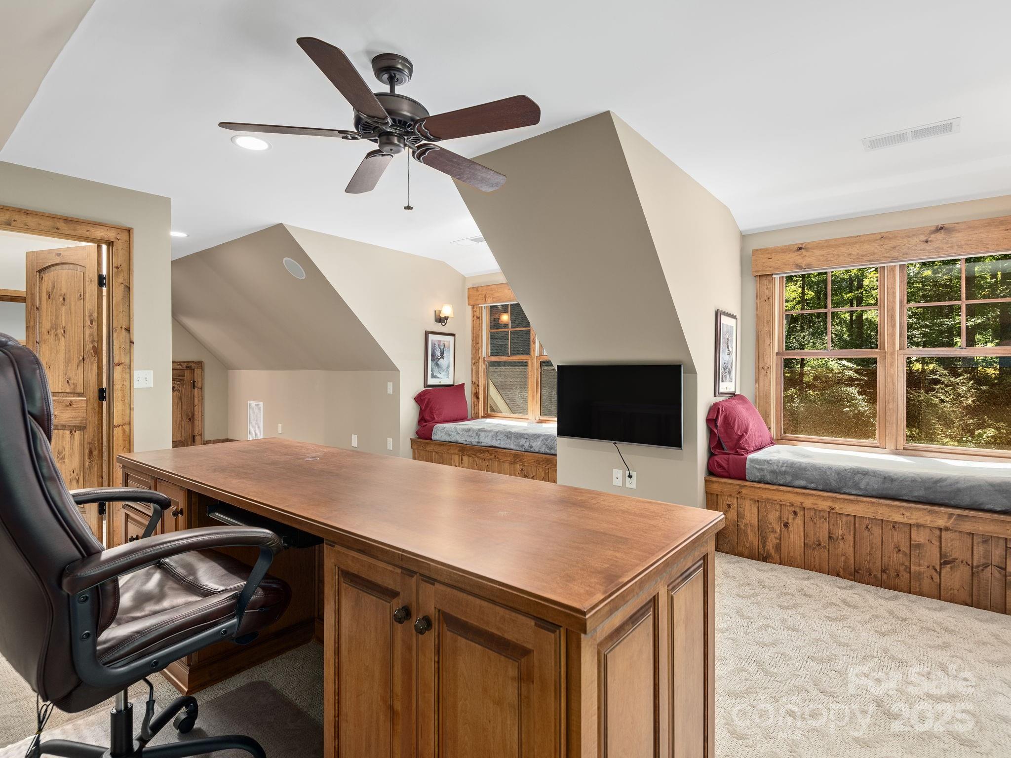 120 Mossy Rock Road Sapphire, NC 28774 - Photo 32 of 47 a living room with a bed furniture and a flat screen tv