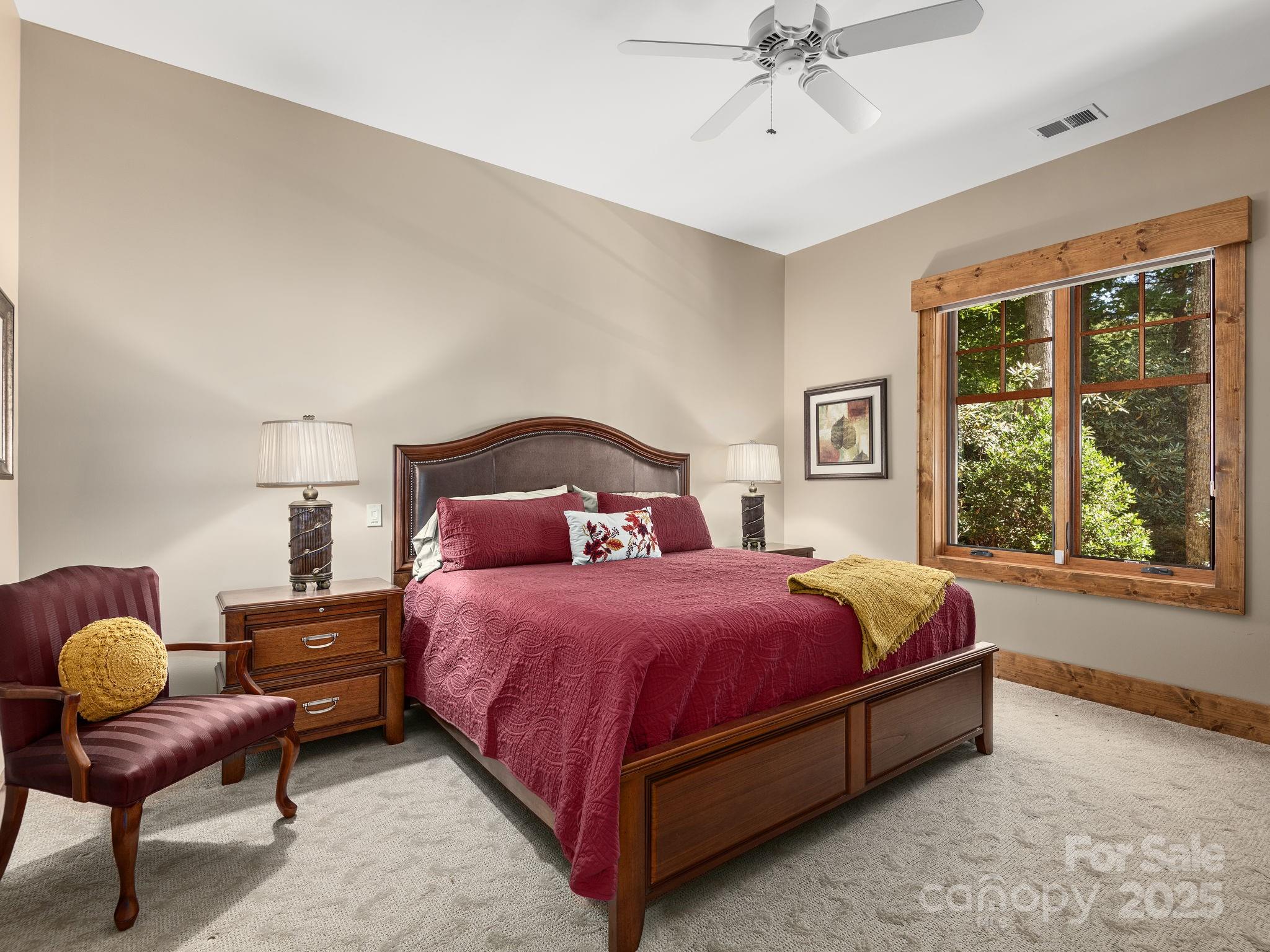 120 Mossy Rock Road Sapphire, NC 28774 - Photo 39 of 47 a bedroom with a bed and window