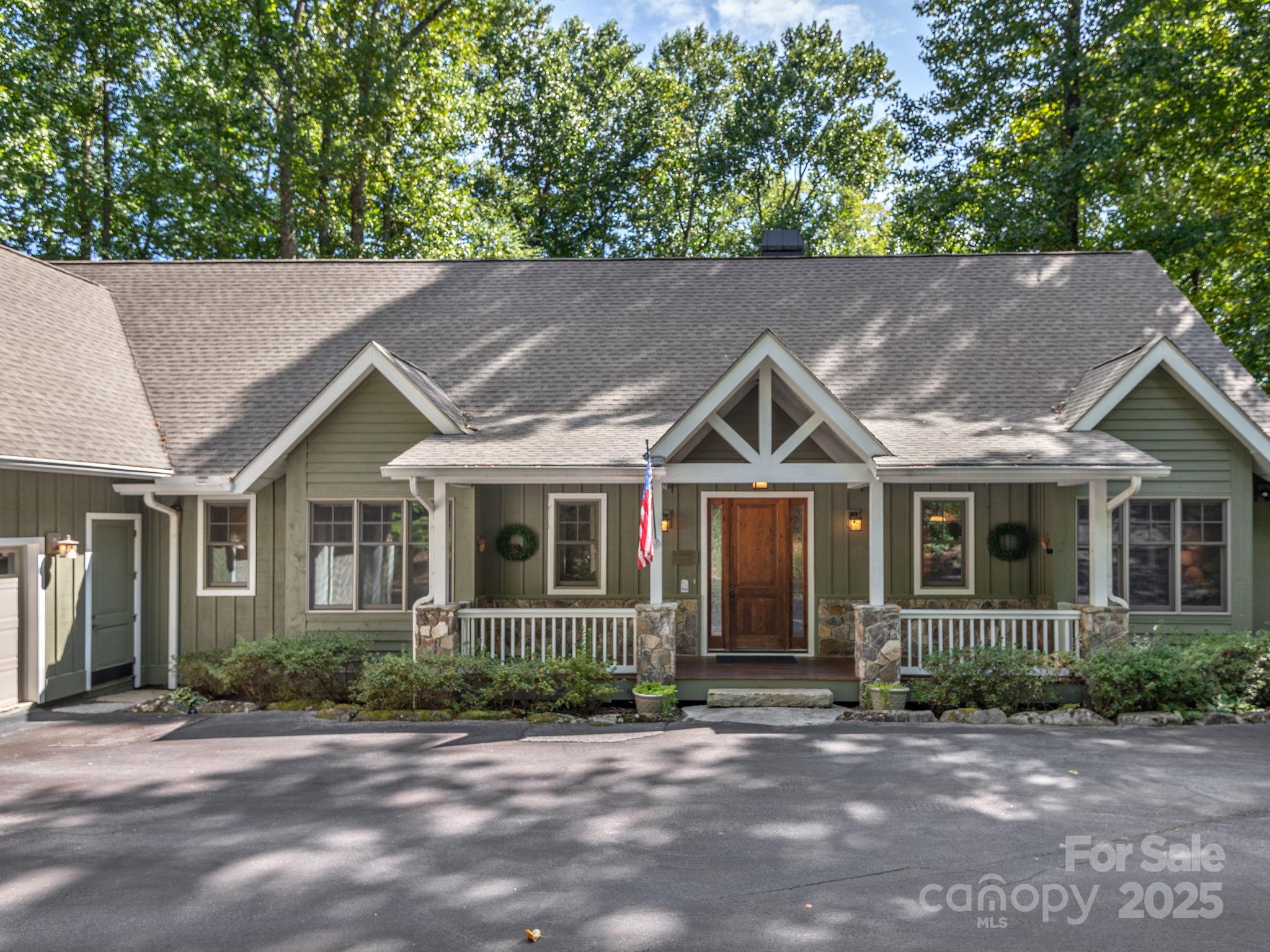 120 Mossy Rock Road Sapphire, NC 28774 - Photo 4 of 47 a backyard of a house with seating space