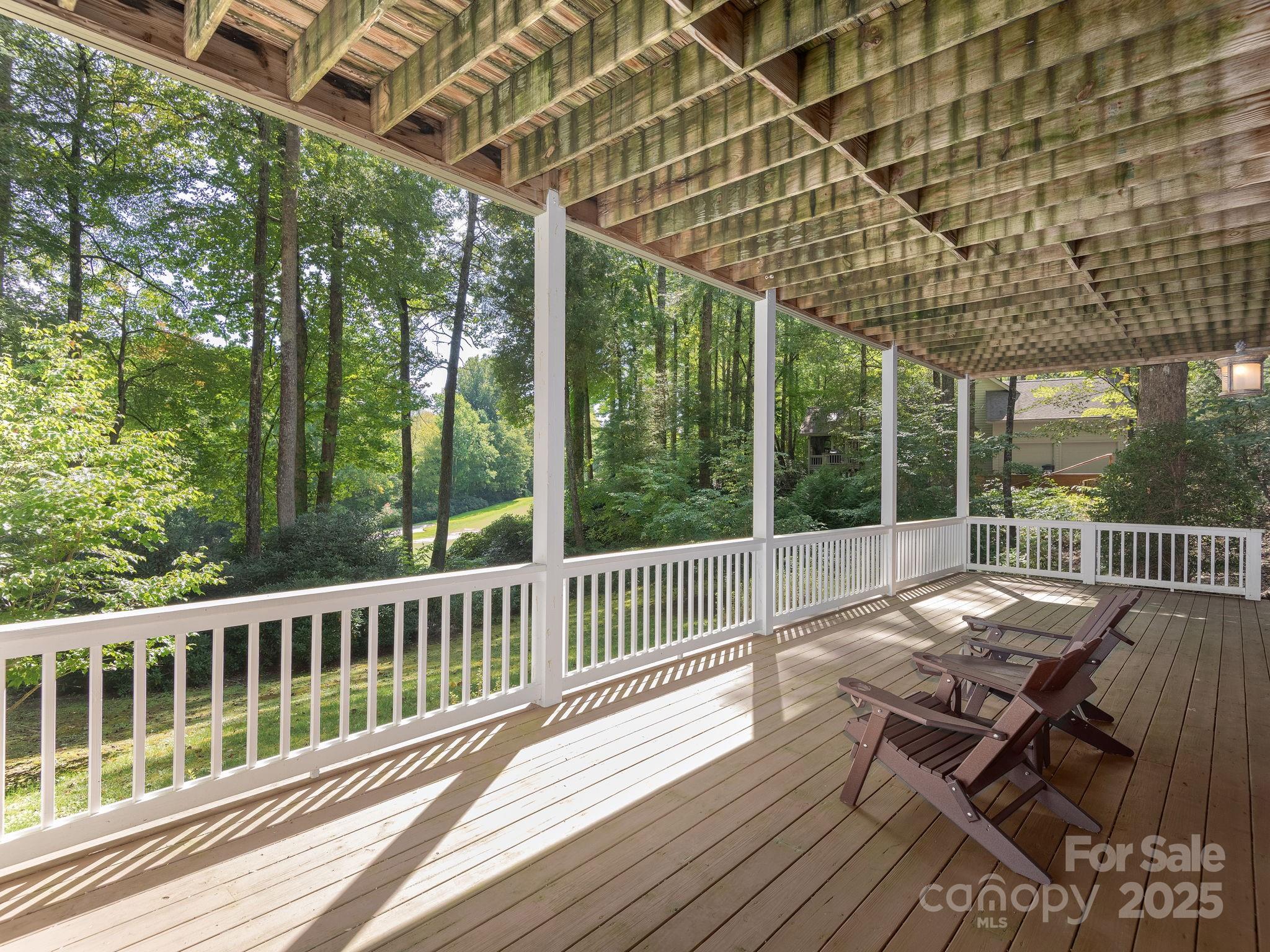 120 Mossy Rock Road Sapphire, NC 28774 - Photo 43 of 47 a view of a chairs and table on the deck