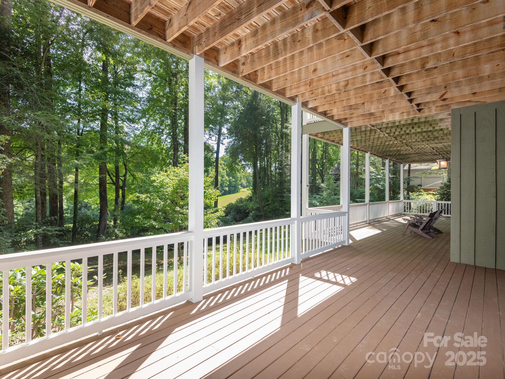 120 Mossy Rock Road Sapphire, NC 28774 - Photo 45 of 47 a view of a balcony with wooden floor