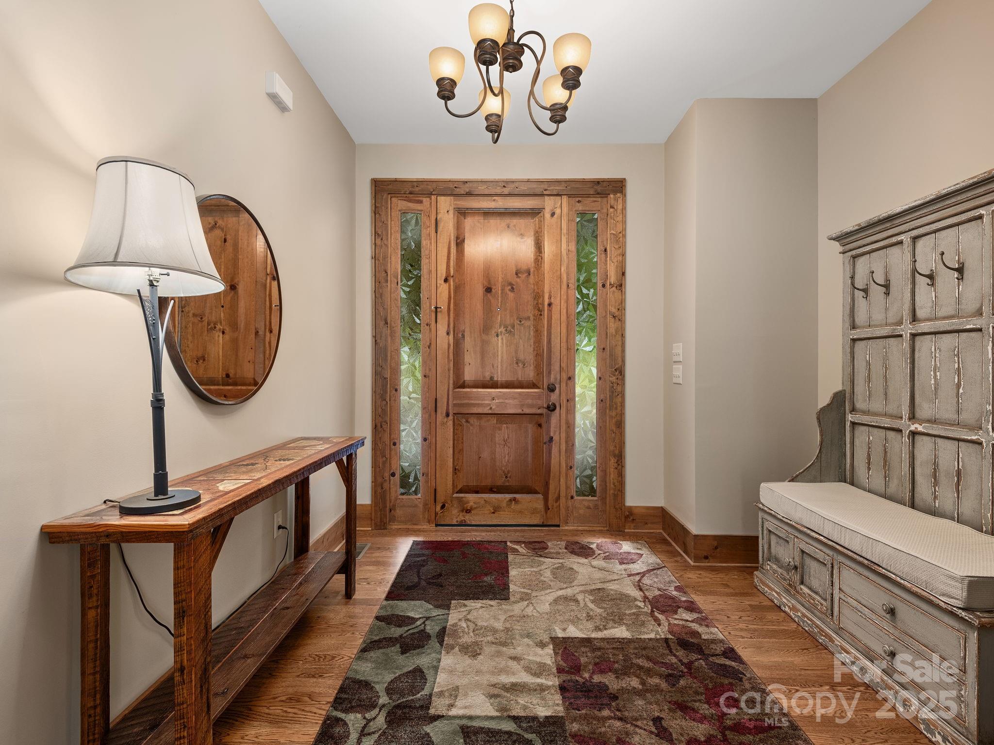 120 Mossy Rock Road Sapphire, NC 28774 - Photo 5 of 47 a front view of a house with entryway