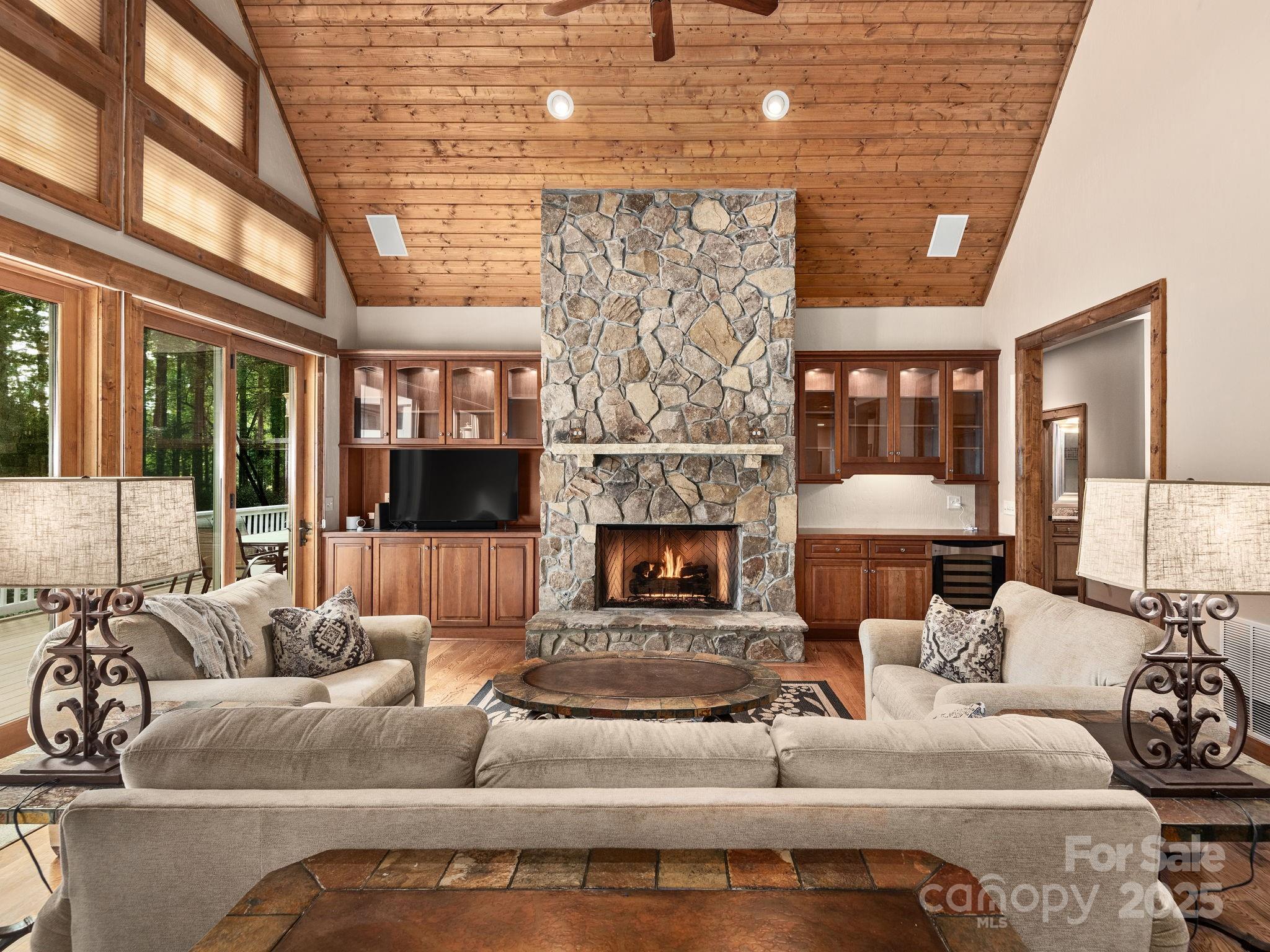 120 Mossy Rock Road Sapphire, NC 28774 - Photo 6 of 47 a living room with furniture and a fireplace