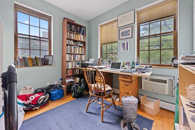 a dining room with furniture and a window