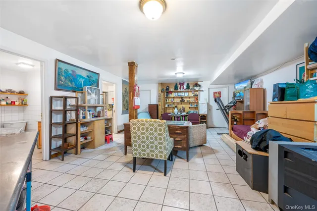 a living room with lots of furniture and white walls