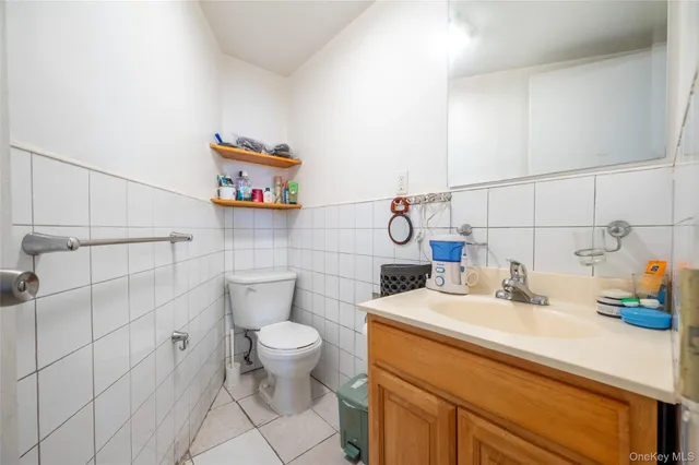 a bathroom with a sink a toilet and vanity