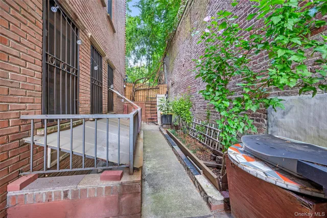 a view of a backyard with sitting area