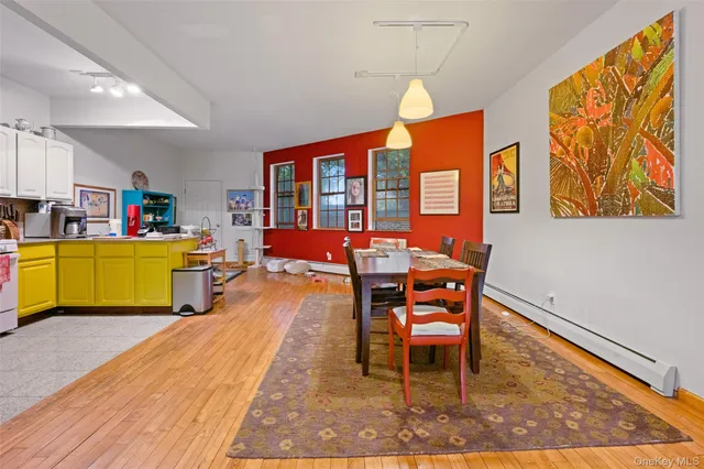 a dining room with a table and chairs