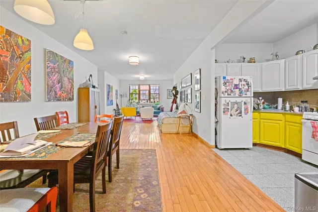 a view of a dining room with furniture and a livingroom
