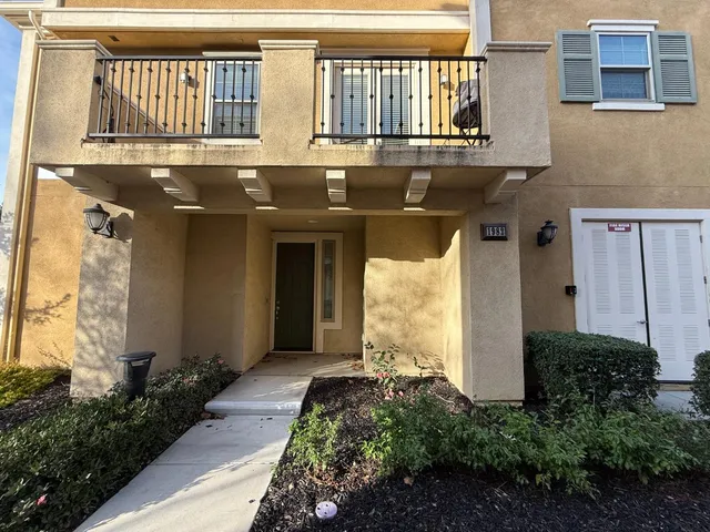 a front view of a house with a garage
