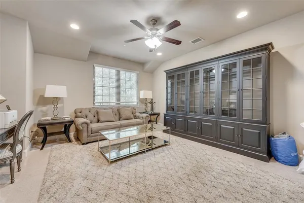 a living room with furniture and white walls
