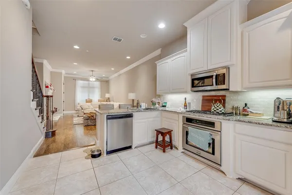 a kitchen with sink cabinets and microwave