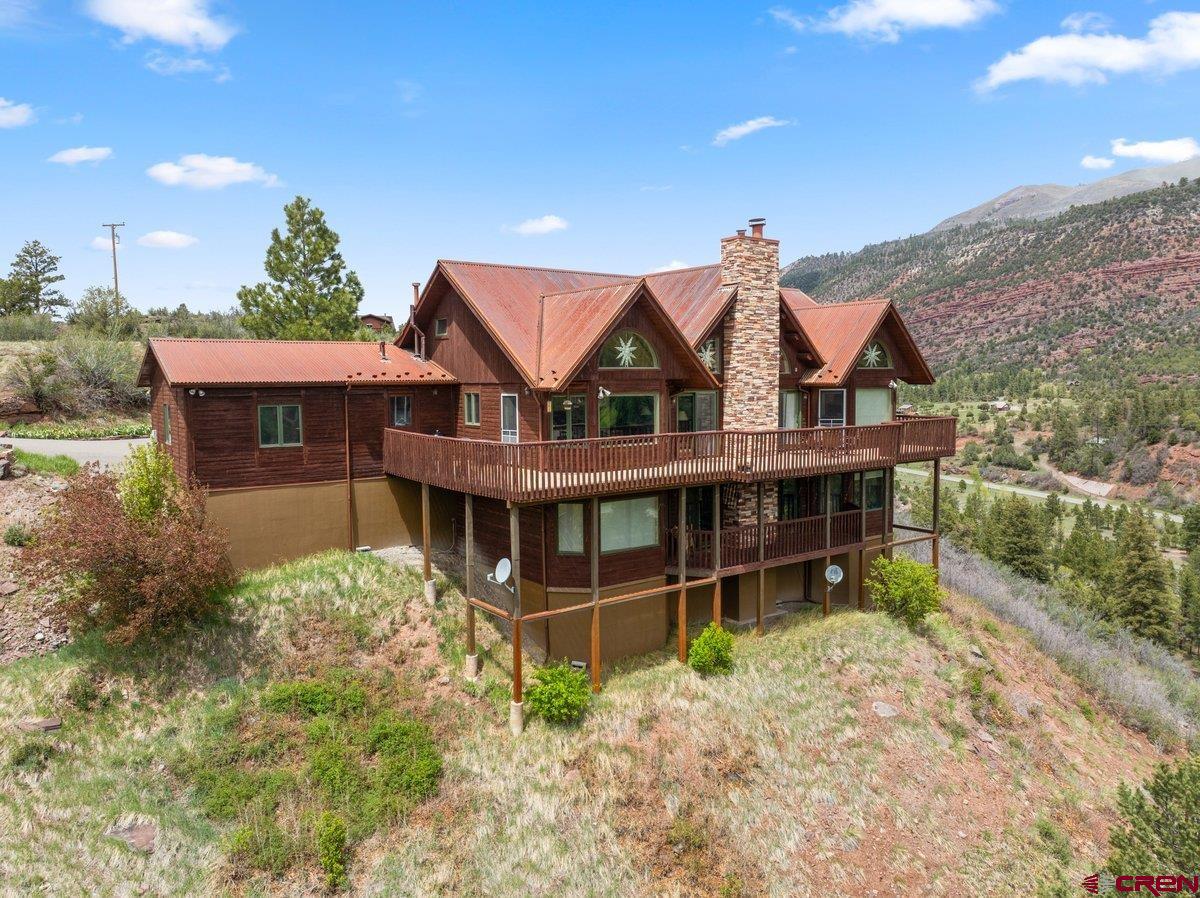 2490 County Road 17 Ridgway, CO 81432 - Photo 8 of 26 a view of a house with a garden and plants