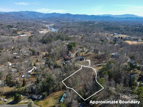an aerial view of house with yard