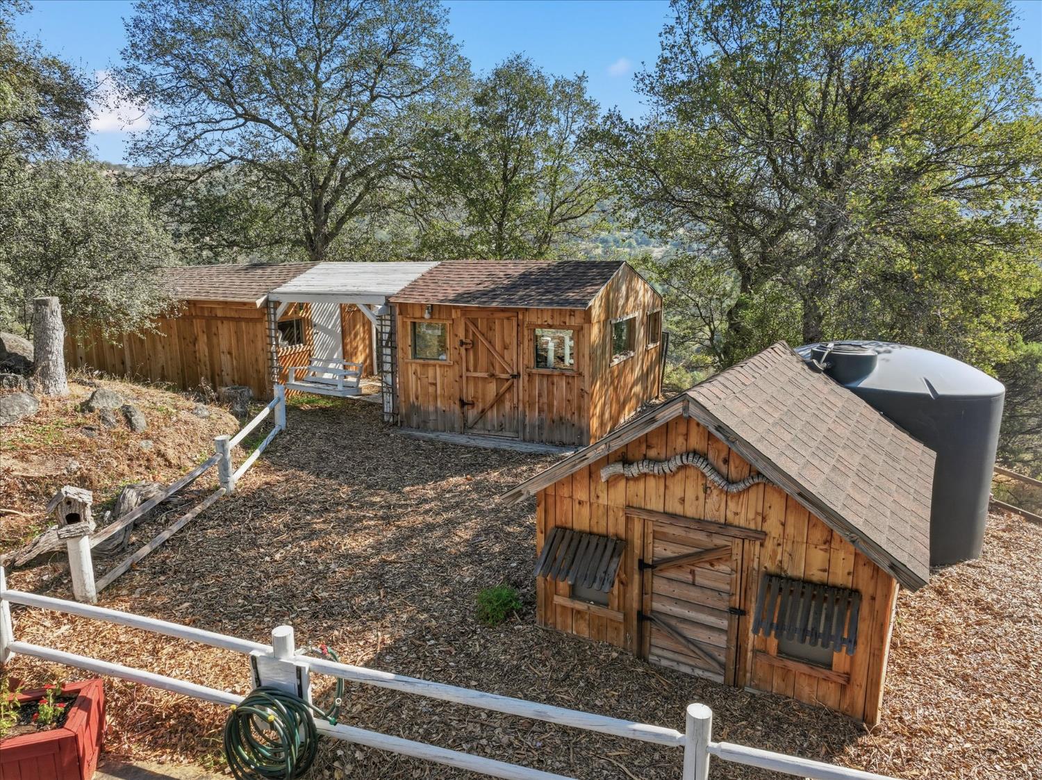 32583 River Knolls Road Coarsegold, CA 93614 - Photo 7 of 63 a view of a house with a yard
