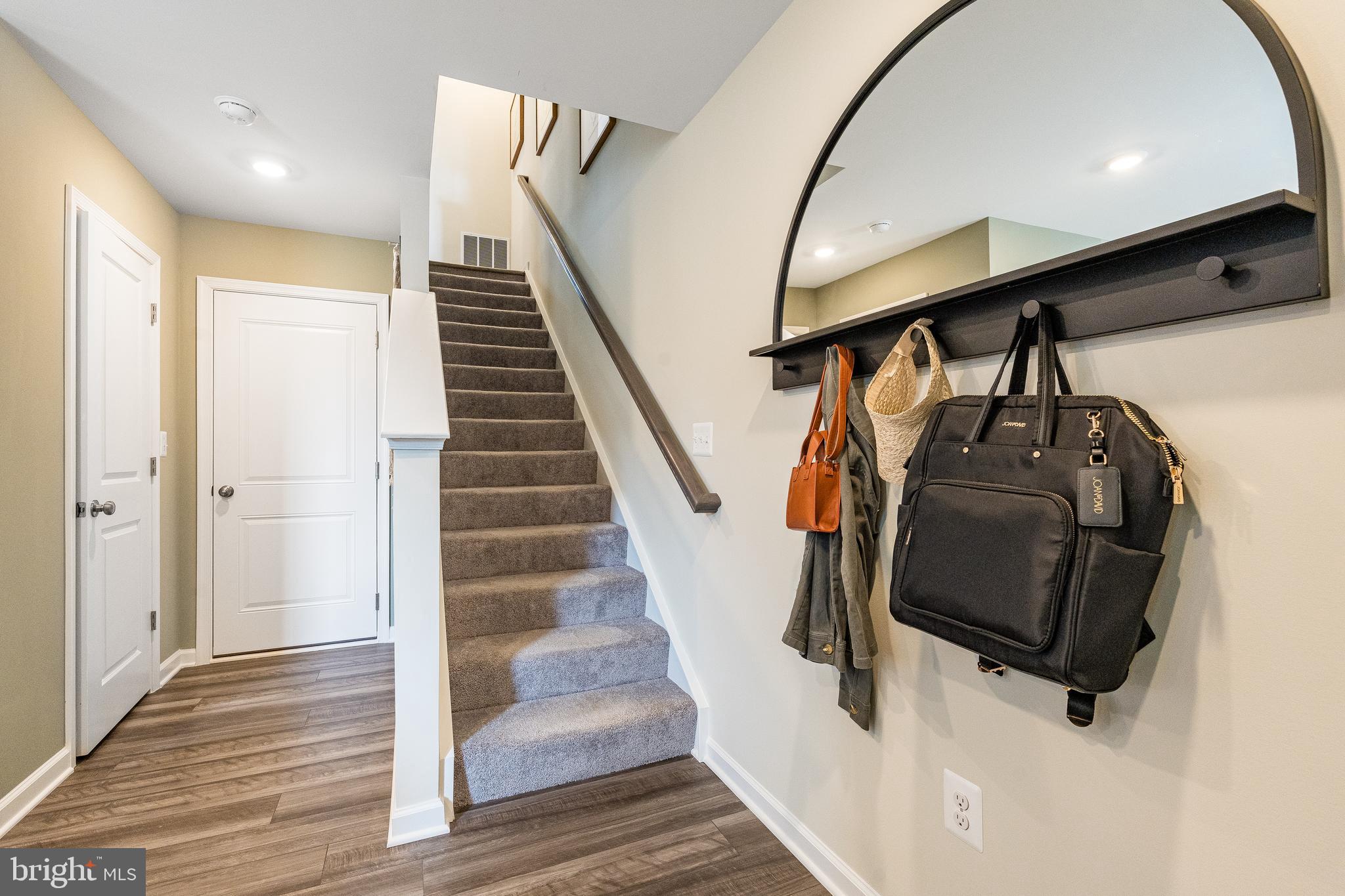 1238 Red Clover Lane Ranson, WV 25438 - Photo 18 of 21 a view of entryway and hall with wooden floor