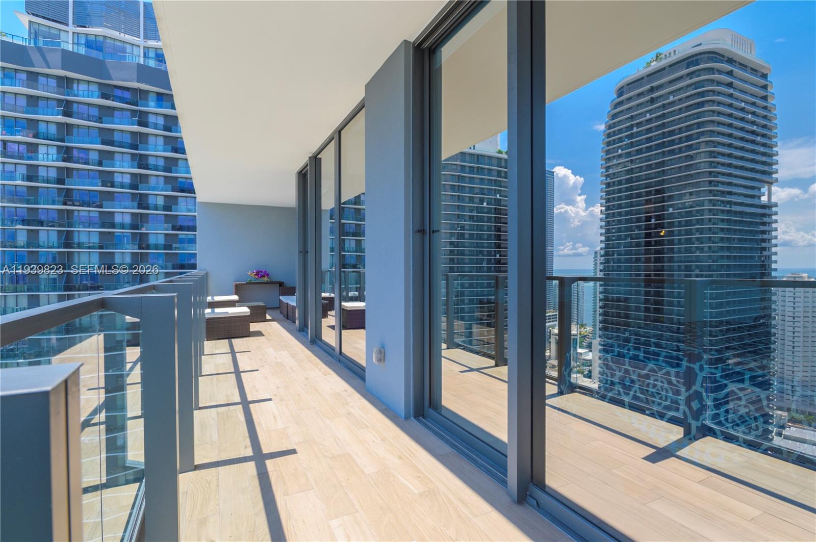 88 Southwest 7th Street, Unit 3405 Miami, FL 33130 - Photo 21 of 37 a balcony with view of living room