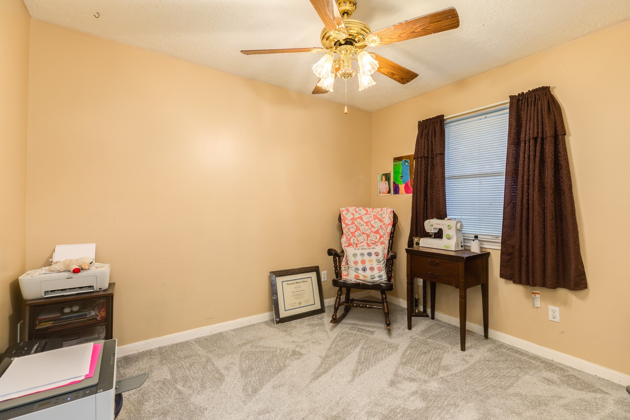 1187 Thomas Drive Angleton, TX 77515 - Photo 18 of 24 a view of a workspace with furniture and a window