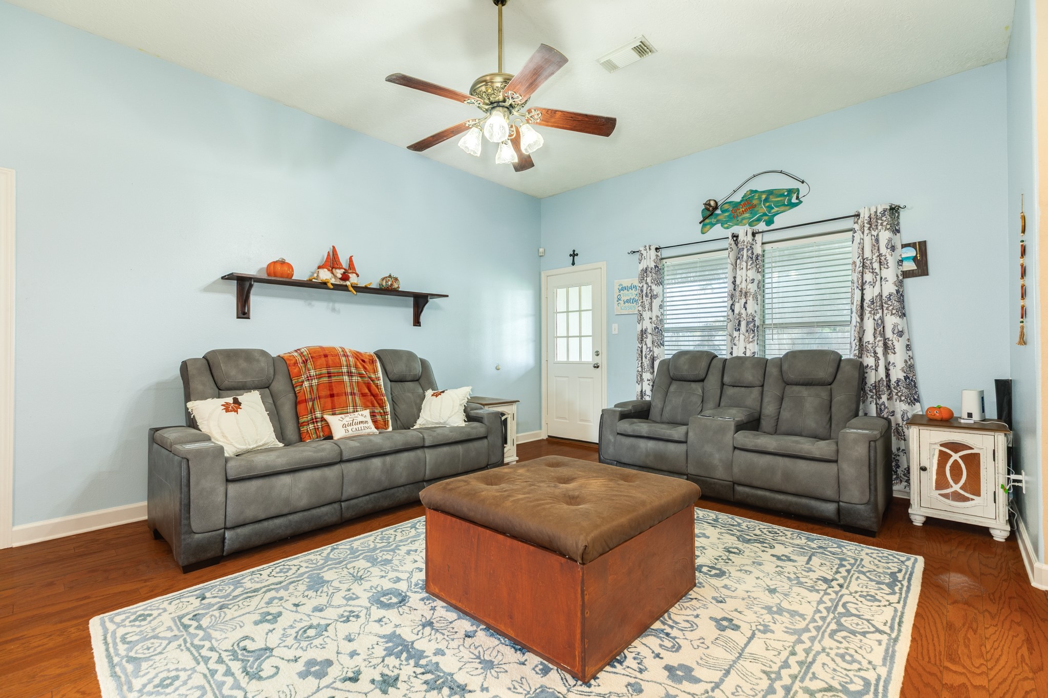 1187 Thomas Drive Angleton, TX 77515 - Photo 6 of 24 a living room with furniture and a chandelier