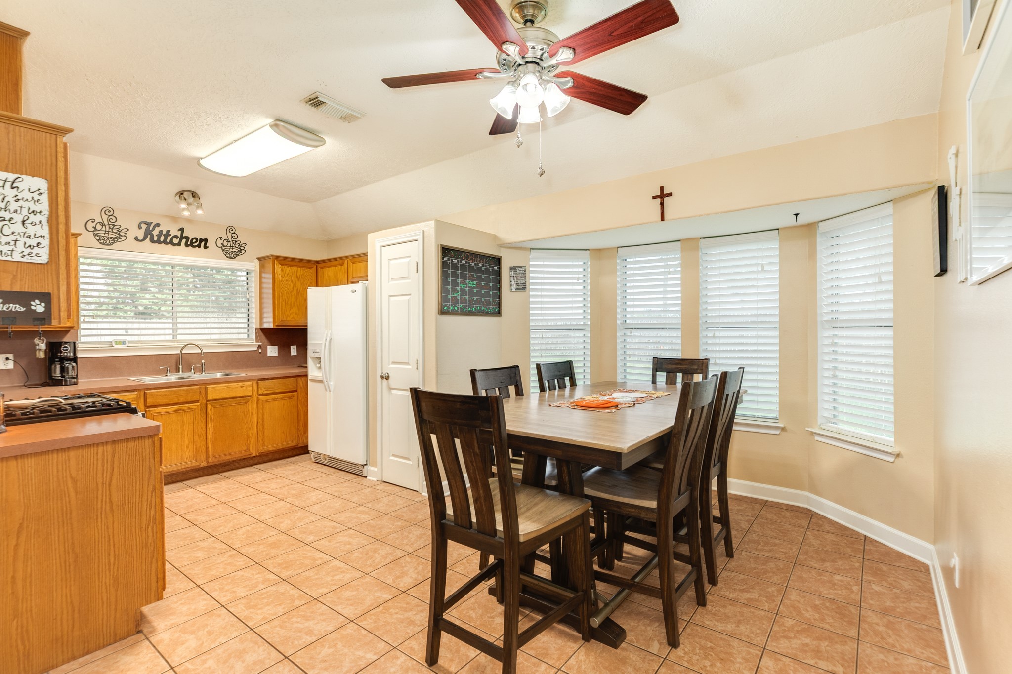 1187 Thomas Drive Angleton, TX 77515 - Photo 10 of 24 a view of a dining room with furniture and a large window
