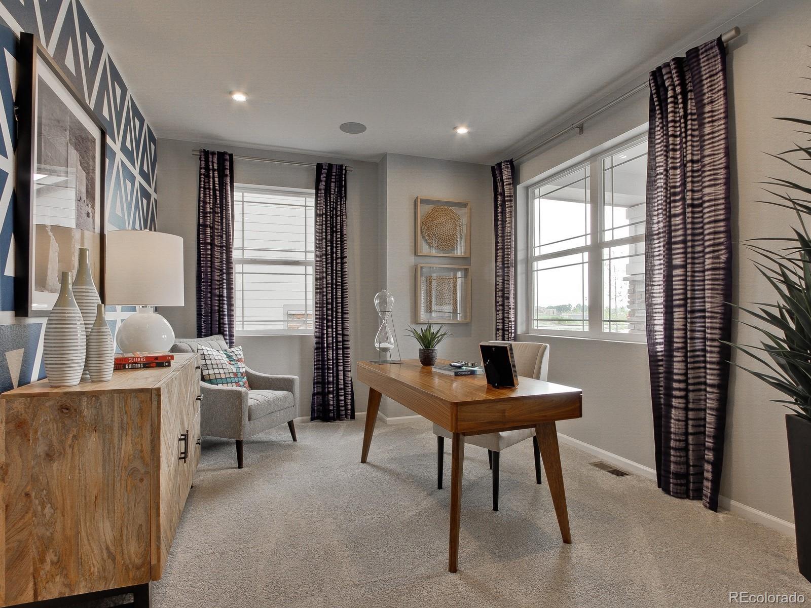 9196 Rifle Street Commerce City, CO 80022 - Photo 12 of 40 a living room with furniture and a window