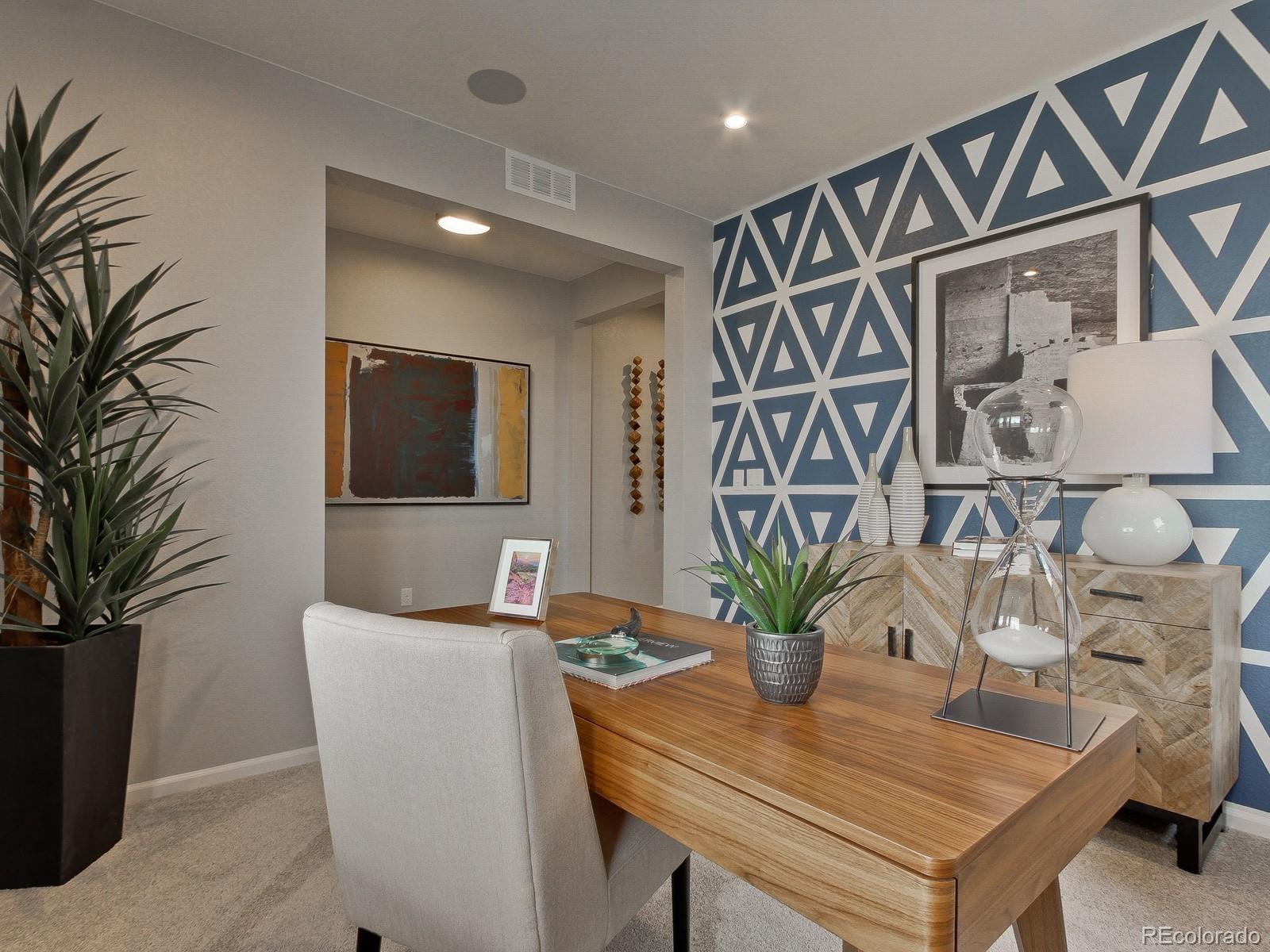 9196 Rifle Street Commerce City, CO 80022 - Photo 13 of 40 a dining room with furniture and potted plants