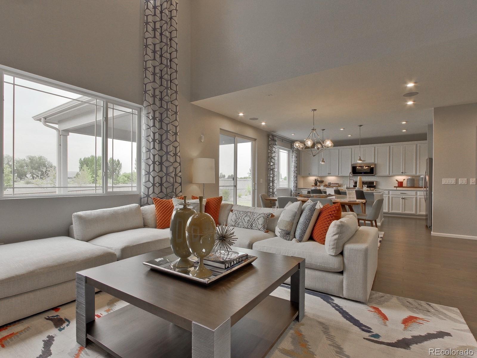 9196 Rifle Street Commerce City, CO 80022 - Photo 16 of 40 a living room with furniture and a large window