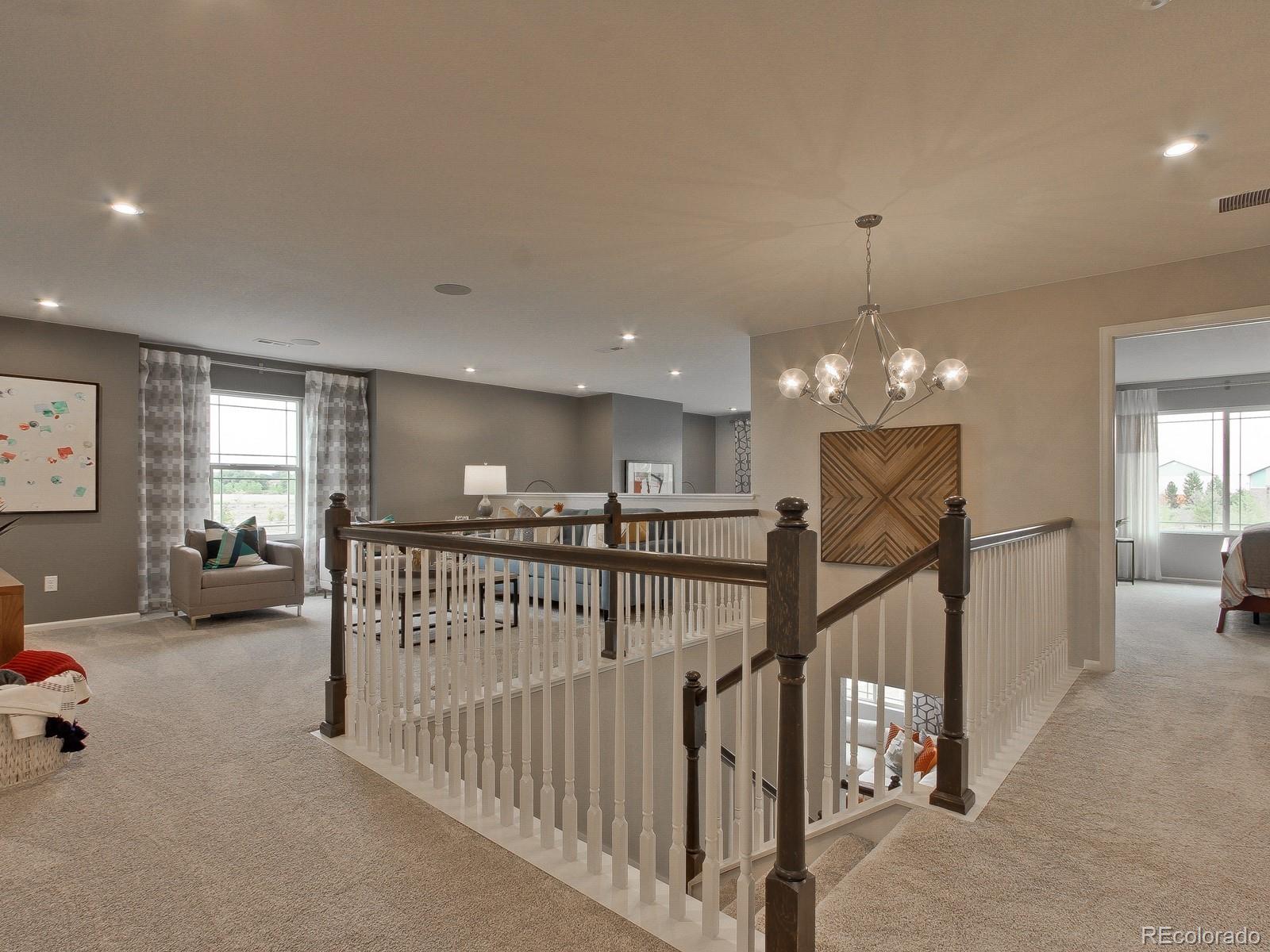 9196 Rifle Street Commerce City, CO 80022 - Photo 19 of 40 a view of a livingroom with furniture and windows