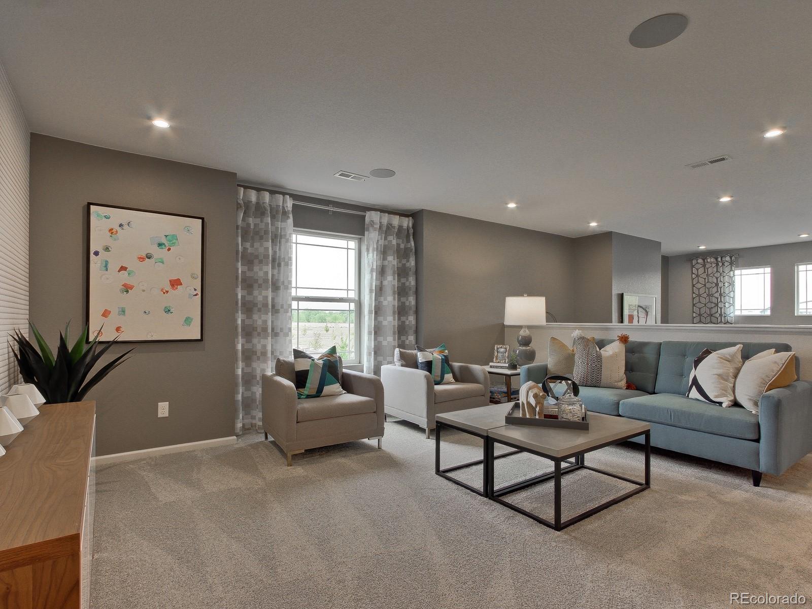9196 Rifle Street Commerce City, CO 80022 - Photo 20 of 40 a living room with furniture and a large window