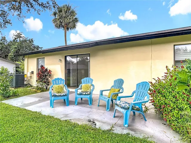 a view of chairs and table in patio