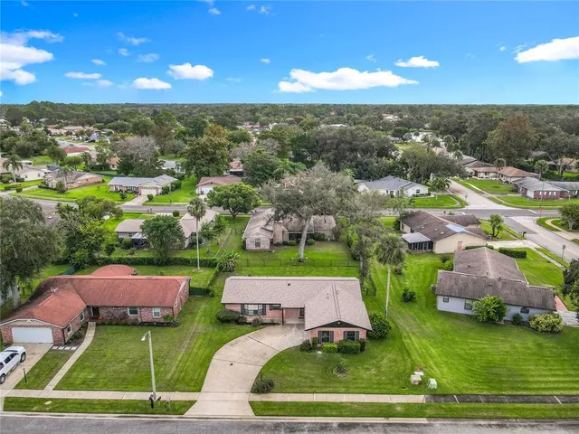 a view of multiple houses with yard