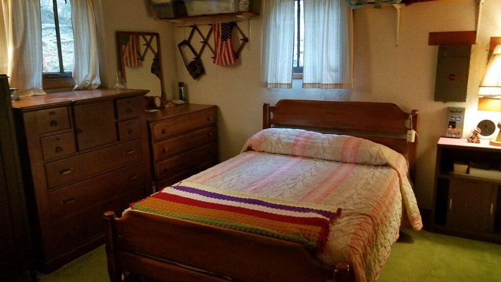 711 Kerney Road Tidioute, PA 16351 - Photo 3 of 6 a bedroom with a bed and a flat tv screen on dresser