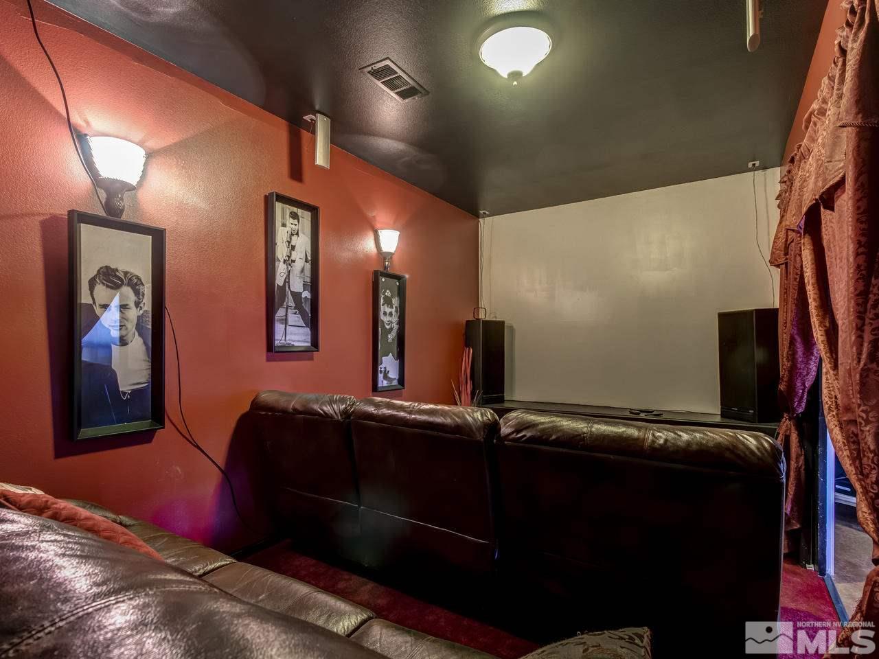 21575 Colt Drive Reno, NV 89521 - Photo 11 of 20 a view of a hallway with paintings on the wall