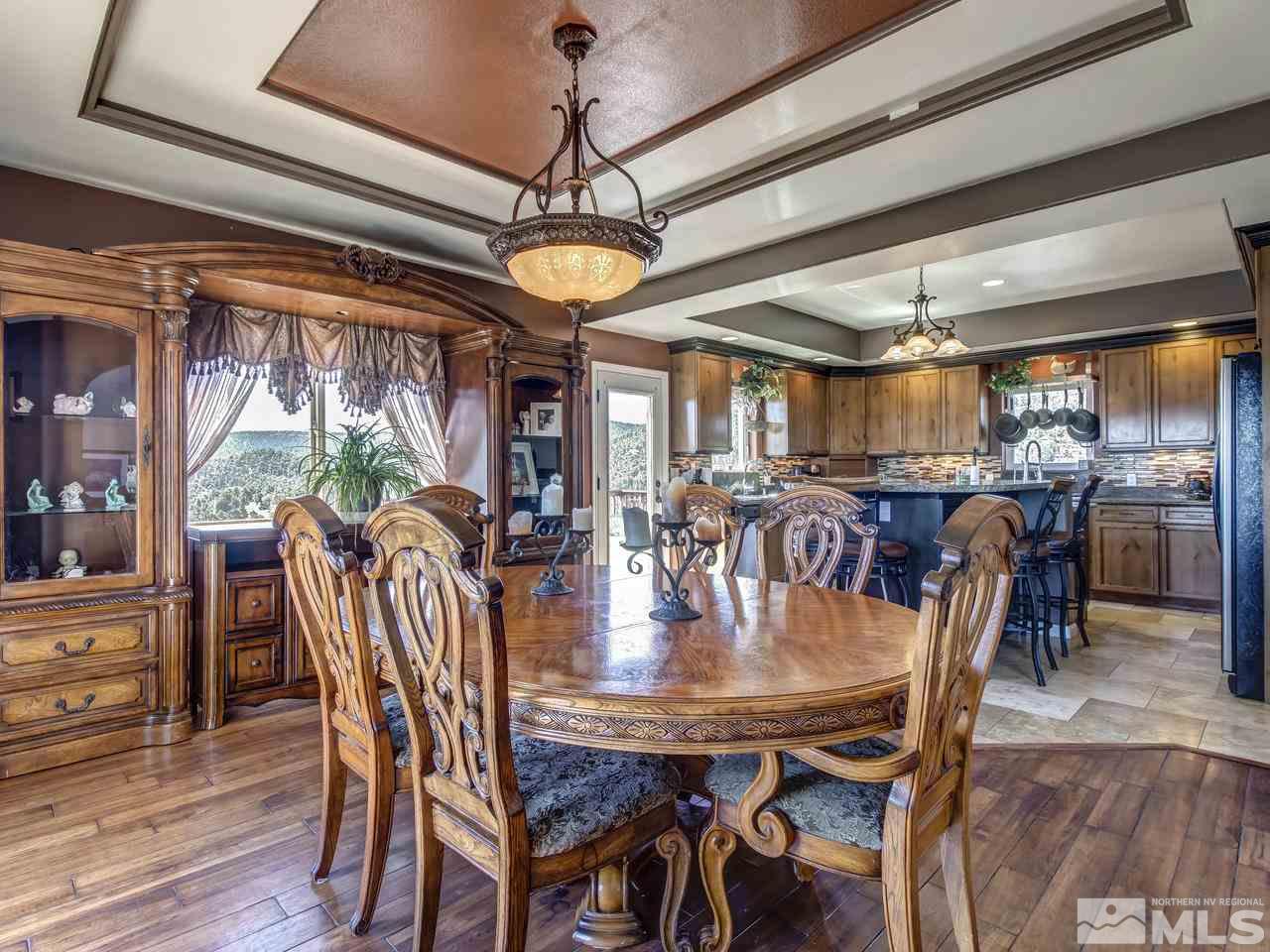 21575 Colt Drive Reno, NV 89521 - Photo 6 of 20 a view of a dining room with furniture window and wooden floor