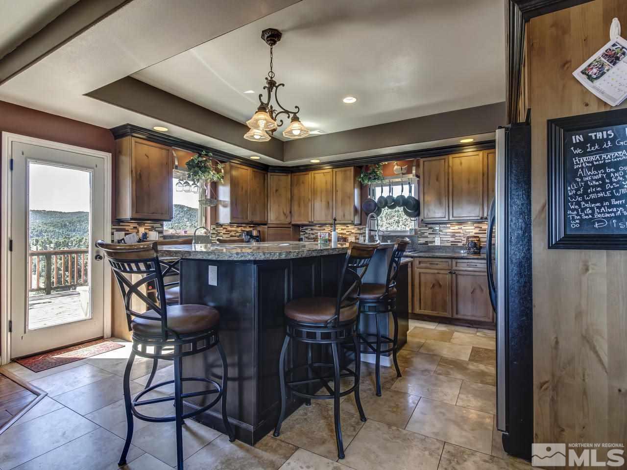 21575 Colt Drive Reno, NV 89521 - Photo 7 of 20 a view of a dining room with furniture window and wooden floor