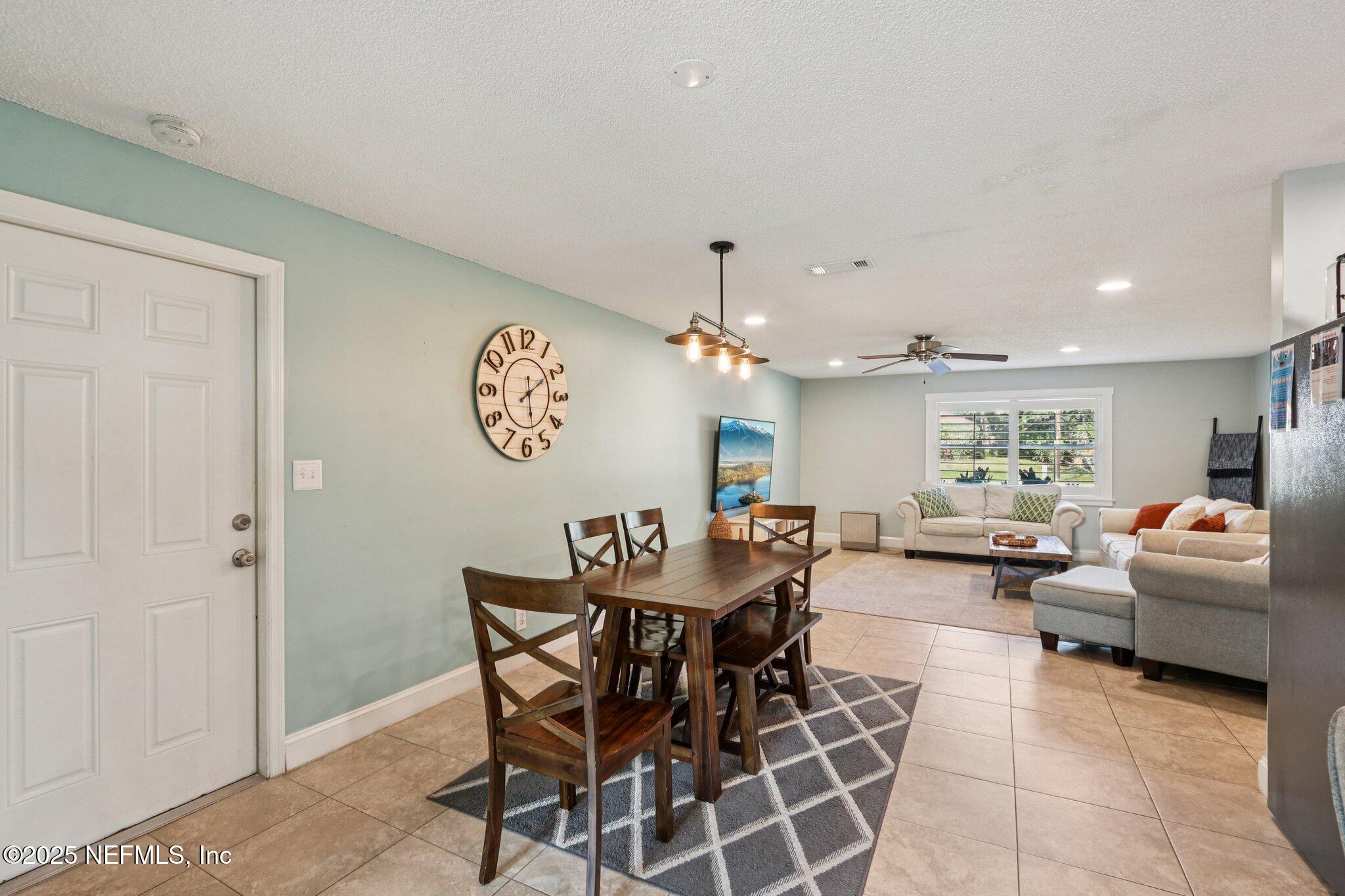 409 Seventeenth Street St. Augustine, FL 32084 - Photo 13 of 42 a dining room with furniture and a chandelier