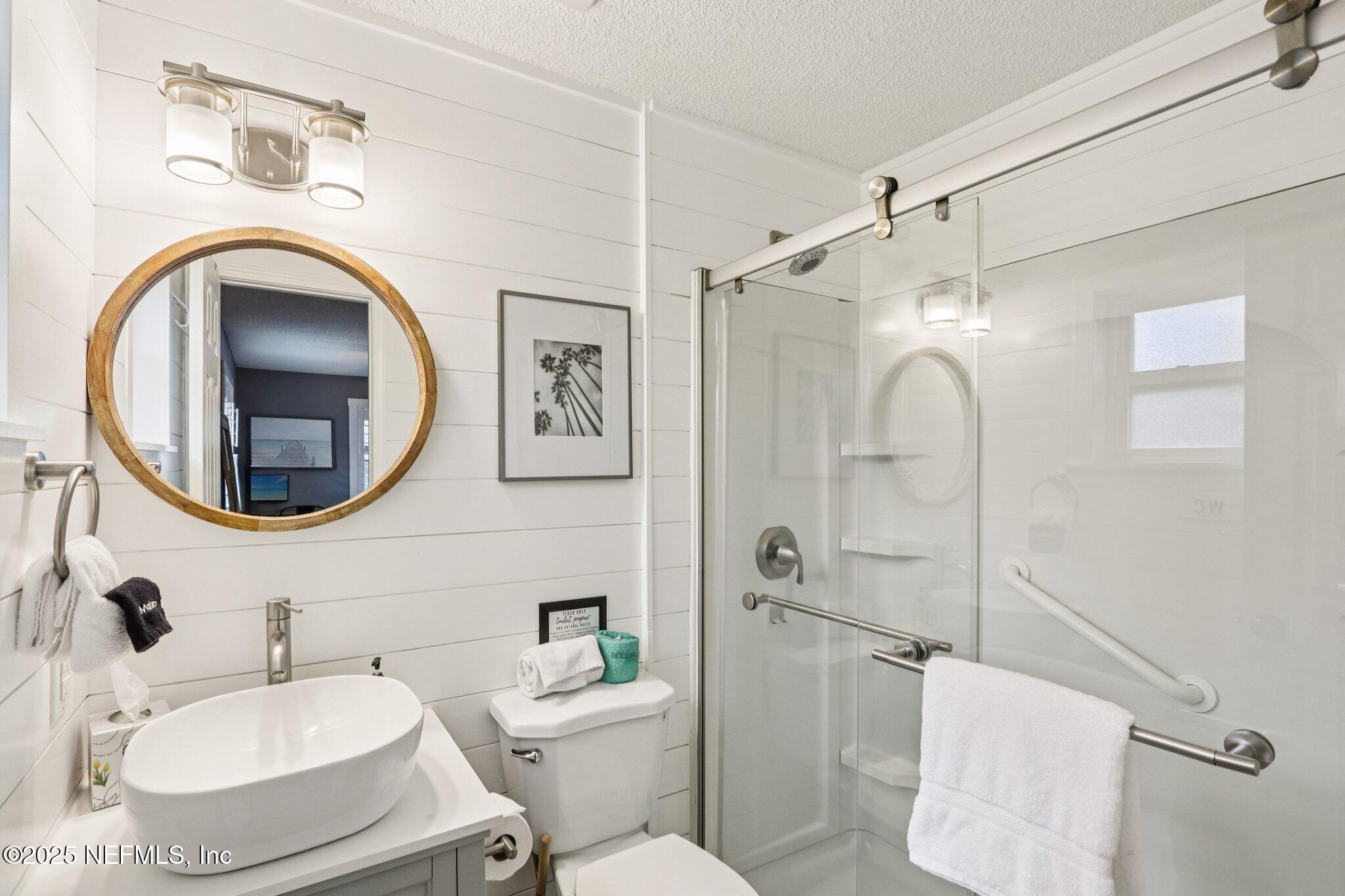 409 Seventeenth Street St. Augustine, FL 32084 - Photo 29 of 42 a bathroom with a sink toilet and shower